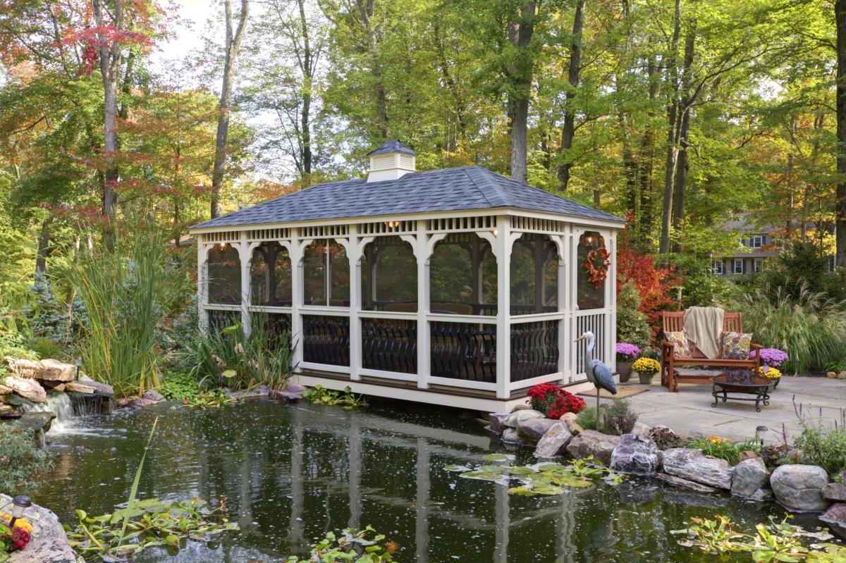 rectangle gazebo with electricity and hip roof near a pond