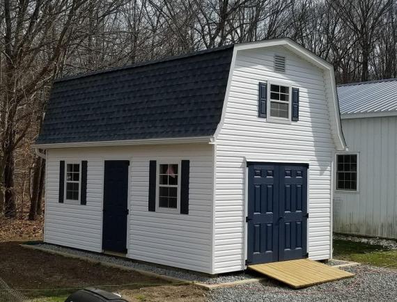 elite classic garden dutch barn with white siding and black doors