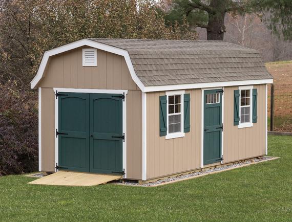 classic garden dutch barn with tan siding and green doors