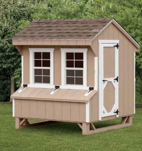 Quaker chicken coop with tan siding, white trim, 2 windows, a side entry door, and brown asphalt roofing.