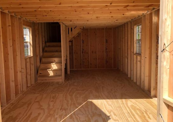 Inside of shed with stairs to a loft